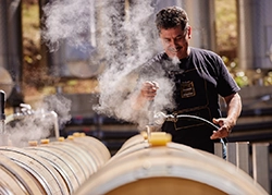 amici cellars - filling up the wine barrels